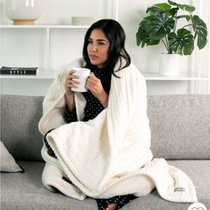 Brookstone Coziest Heated Cable Knit Throw blanket in ivory 50x60